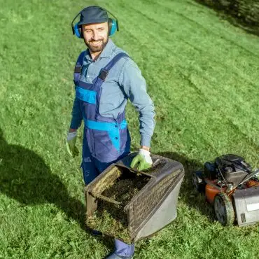 team members | gardener working with lawn mower on the backyard 2023 11 27 04 53 11 utc