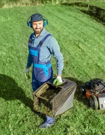 alex | gardener working with lawn mower on the backyard 2023 11 27 04 53 11 utc