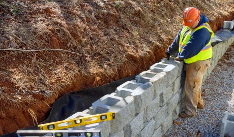 service | construction worker is using cement blocks for bui 2023 11 27 05 31 22 utc